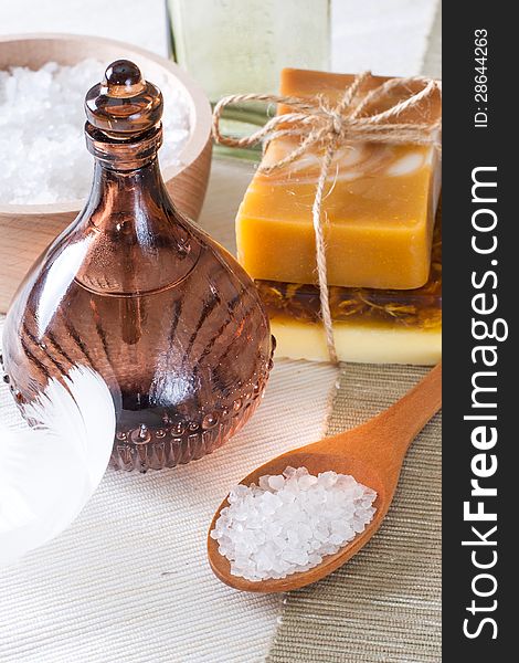 Handmade soap and sea salt in a wooden bowl