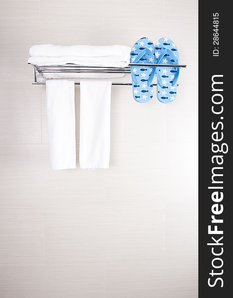 Bathroom accessory clean towels and blue flip-flop. Bathroom accessory clean towels and blue flip-flop