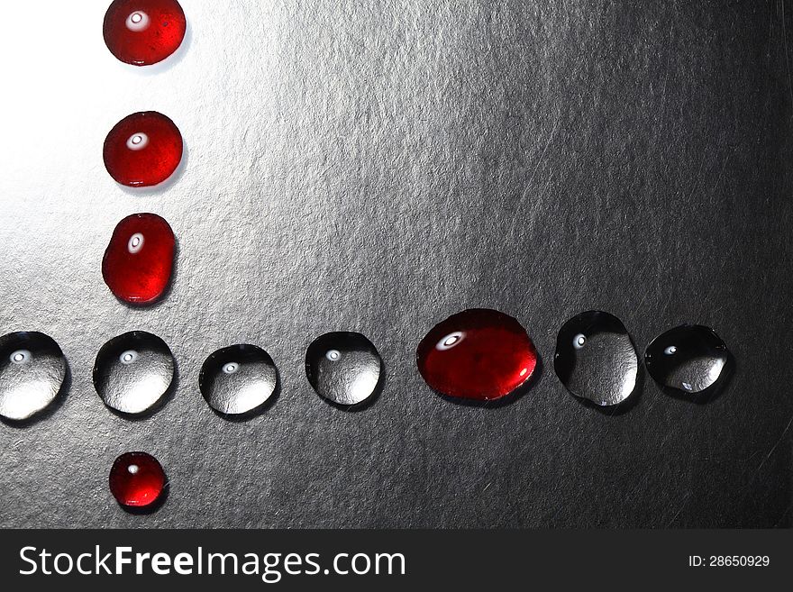 Red and transparent drops as border on dark background. Red and transparent drops as border on dark background