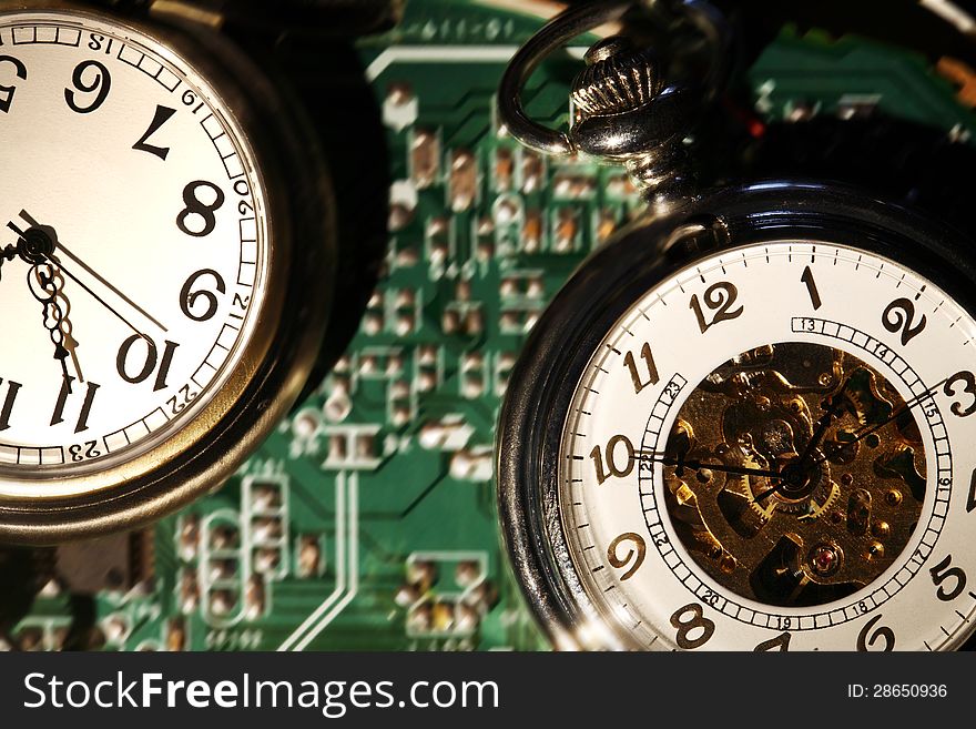 Closeup of watches on abstract green technology background. Closeup of watches on abstract green technology background