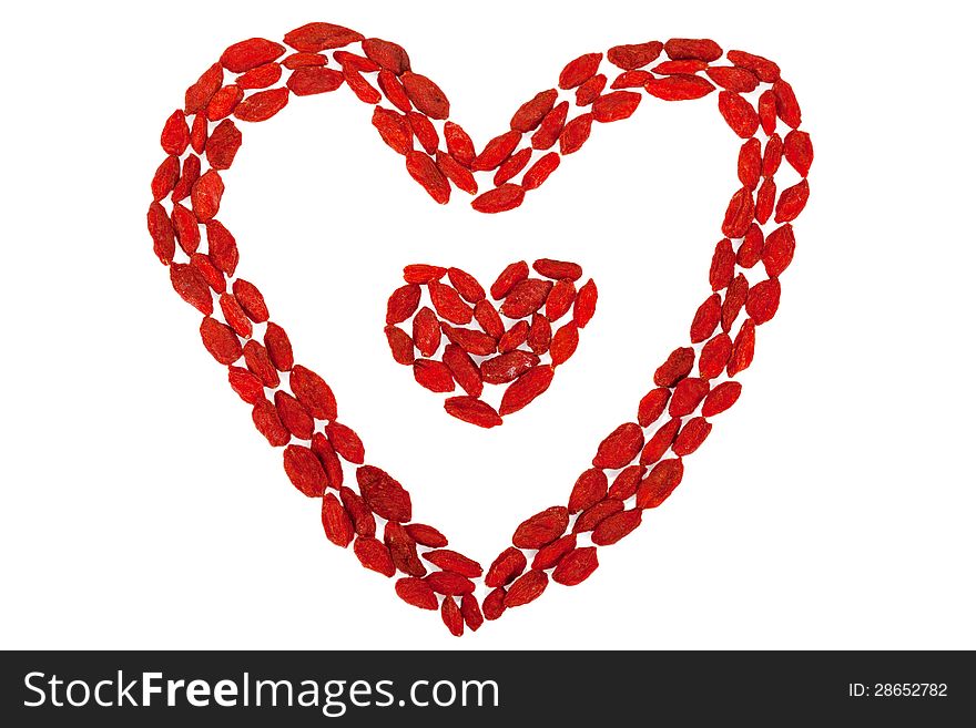 Goji berries heart shaped isolated on white