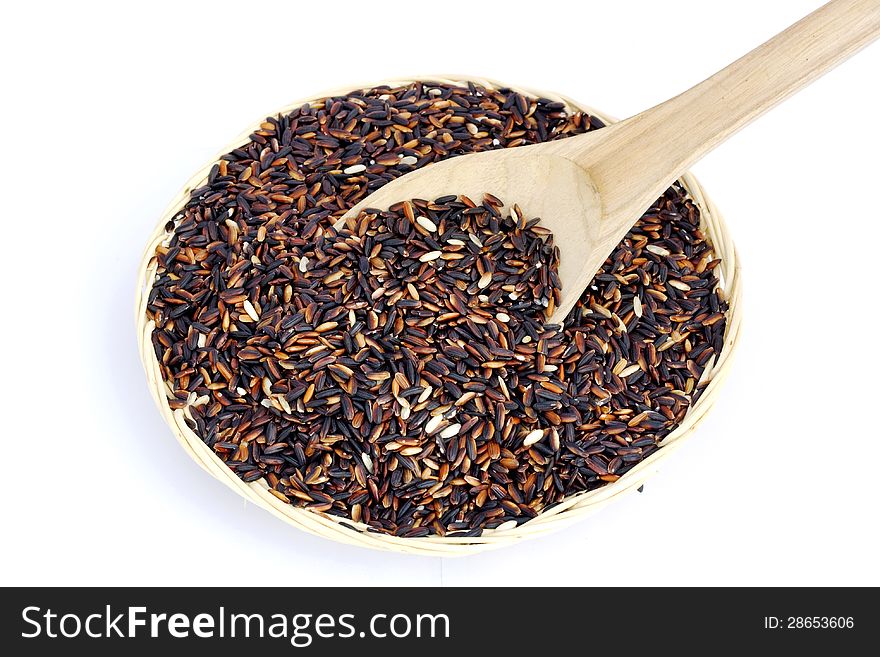 Black Purple Rice in bamboo basket on white background