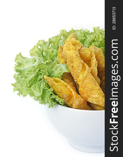 Thai Fried Wonton and salad leaves on white background. Thai Fried Wonton and salad leaves on white background