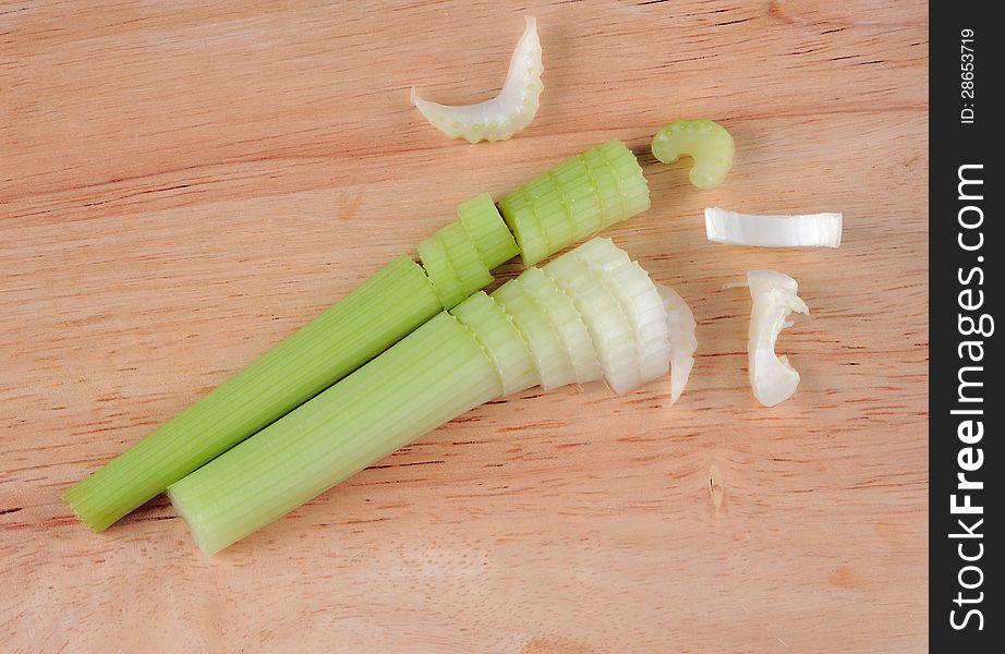 Fresh celery on wood cutting board