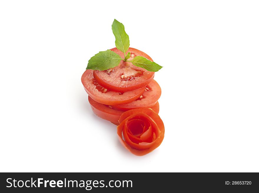 Fresh tomato splices on white background.