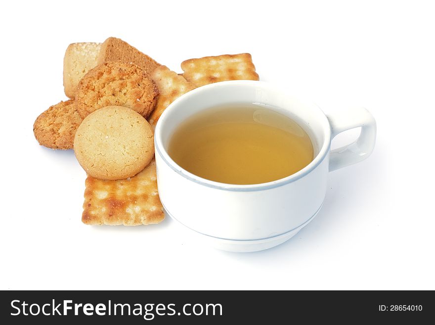 A lots of kinds of butter cookies and a cup of tea on white background. A lots of kinds of butter cookies and a cup of tea on white background.