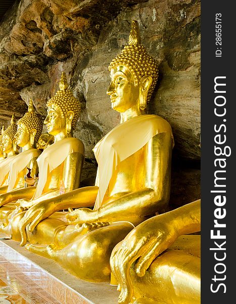 Golden Buddha statue in  cave, Ubonratchathani, Thailand