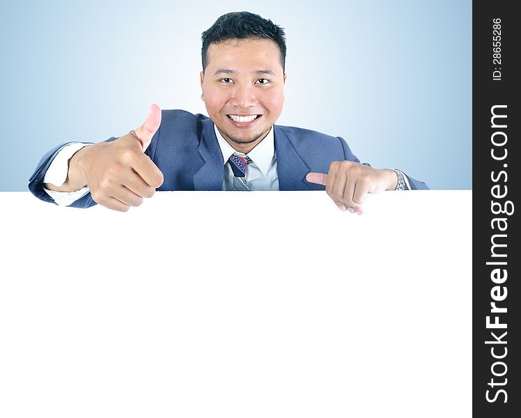 Business man holding white board with thumb up