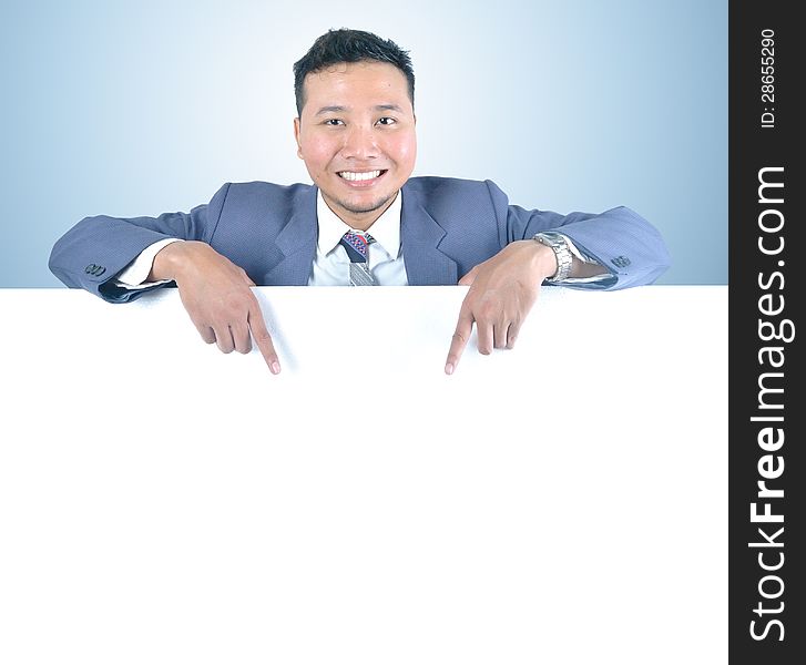 Business man holding white board template