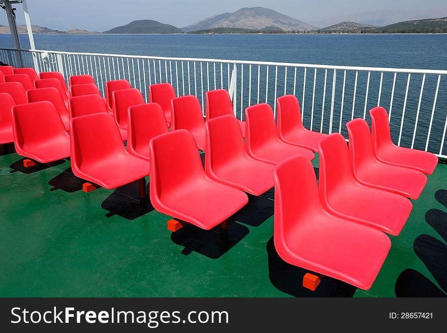 Red stadium chair on the boat deck. Red stadium chair on the boat deck