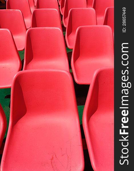 Red stadium chair, closeup image