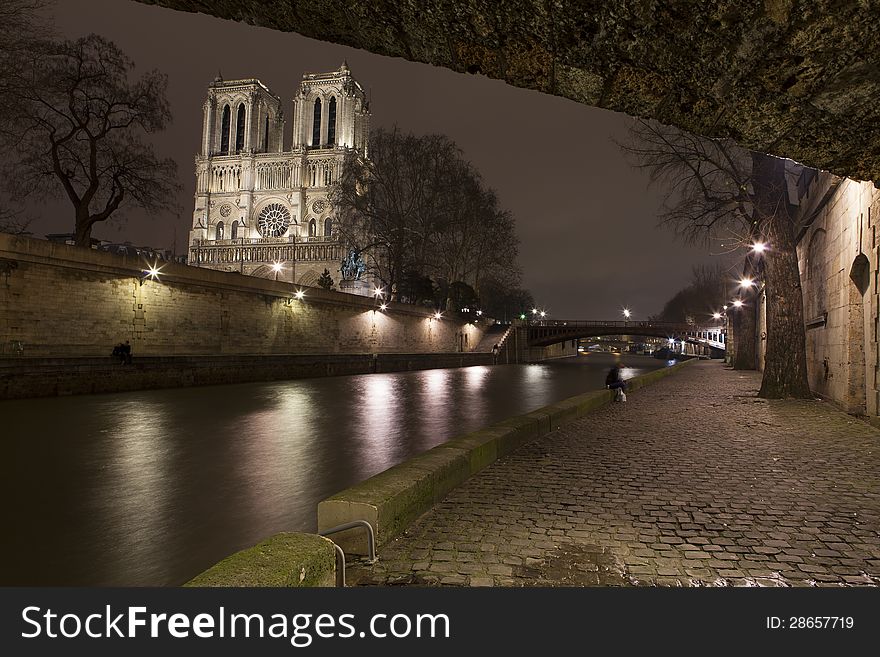 Illuminate Notre-Dame From Paris With Sena In The Night