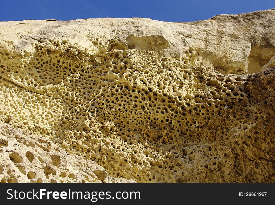 Weathered sandstone with holes near train station Nevsha, Bulgaria. Weathered sandstone with holes near train station Nevsha, Bulgaria