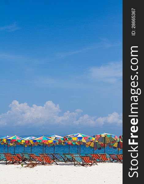 Umbrellas and chairs on the beach with bluesky