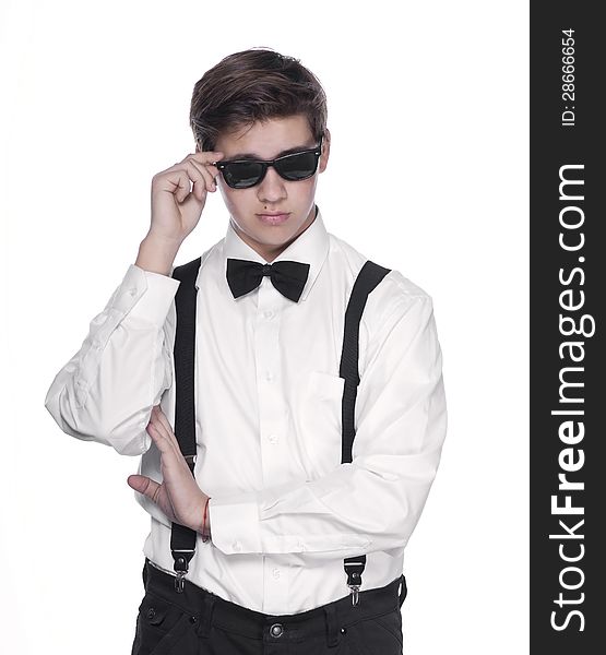 Fashion young man holding his fashionable sunglasses on white background