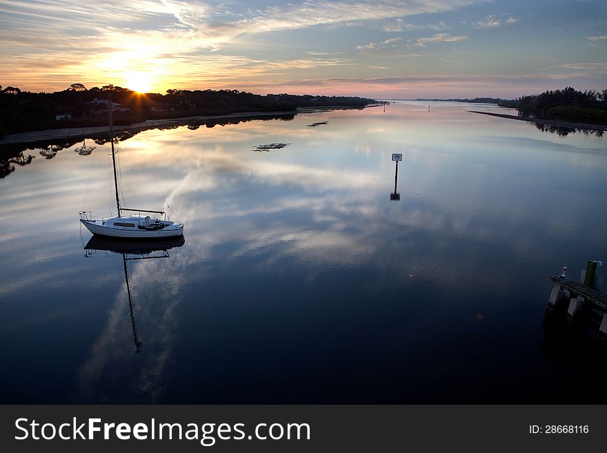 Sunrise with sailboat at Manasota Bridge, Florida