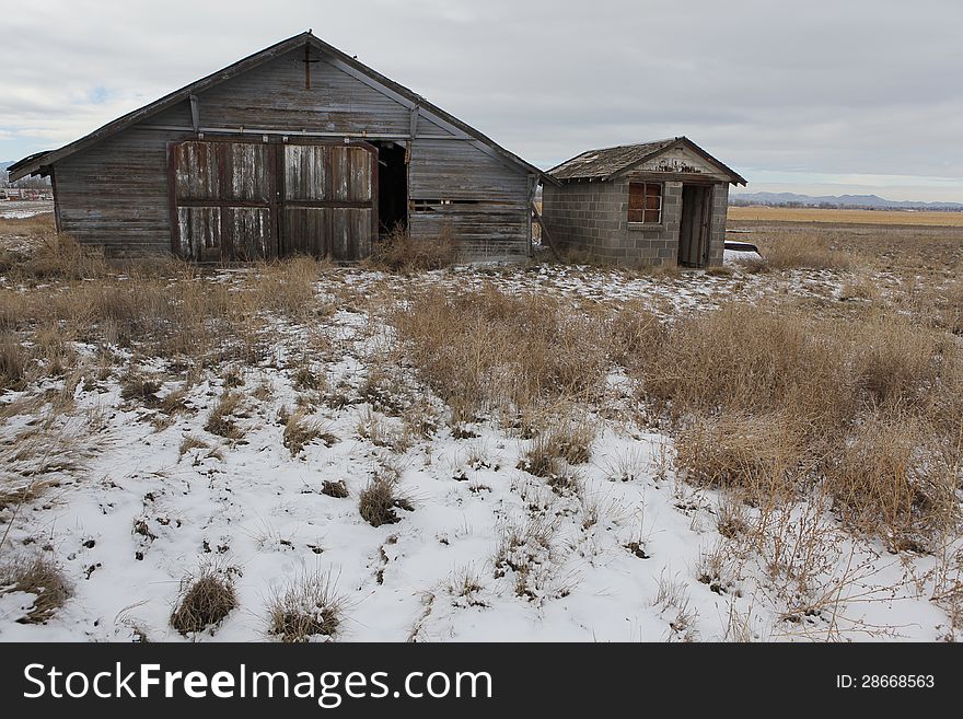 Old farmers garage in a field in Colorado. Old farmers garage in a field in Colorado.