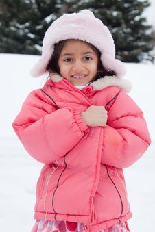 Happy East Indian Girl Playing In The Snow Royalty Free Stock Images Happy East Indian Girl Playing In The Snow Royalty Free Stock Images
