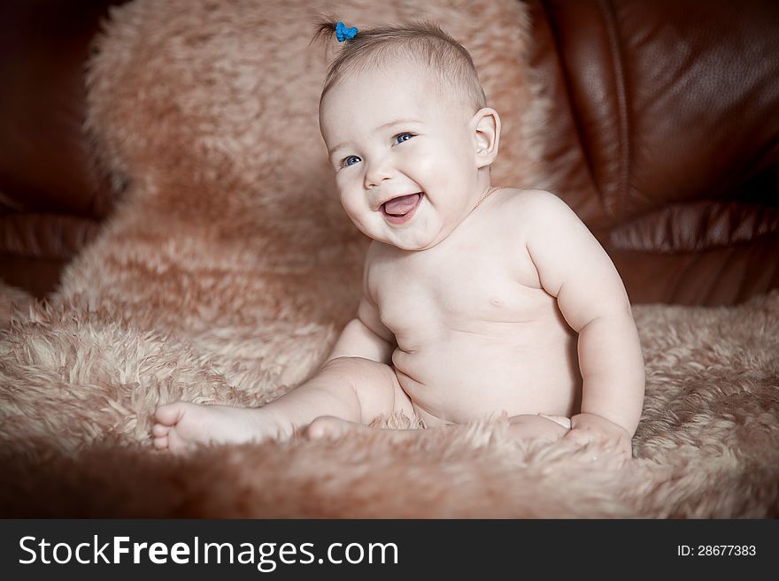 Child Sitting On Fur