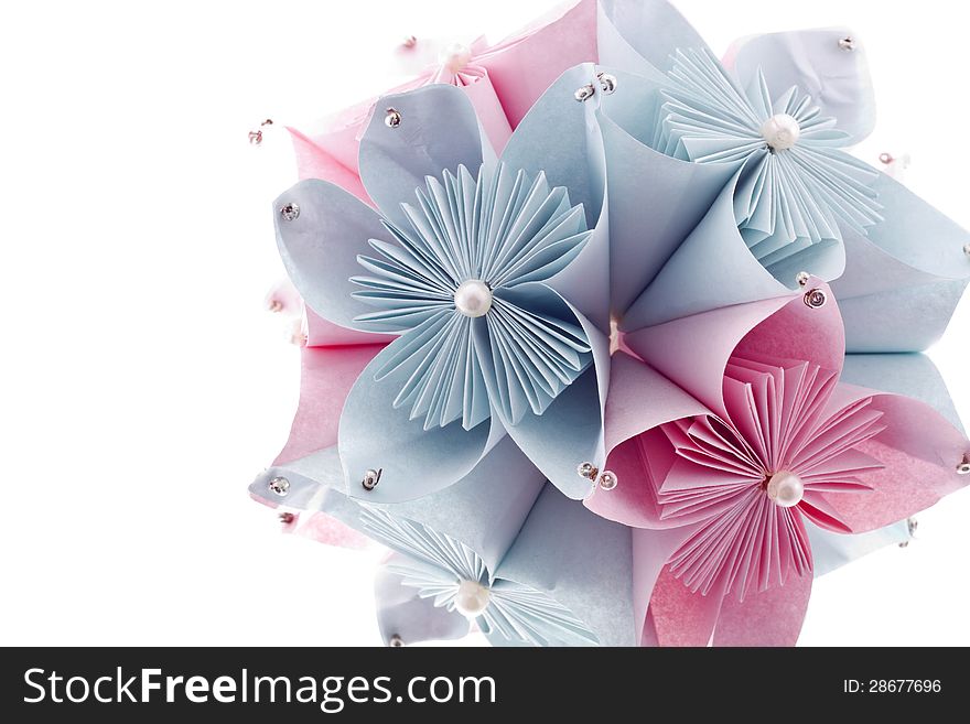 Classic Royal kusudama. Colorful pink and blue paper origami isolated on white.