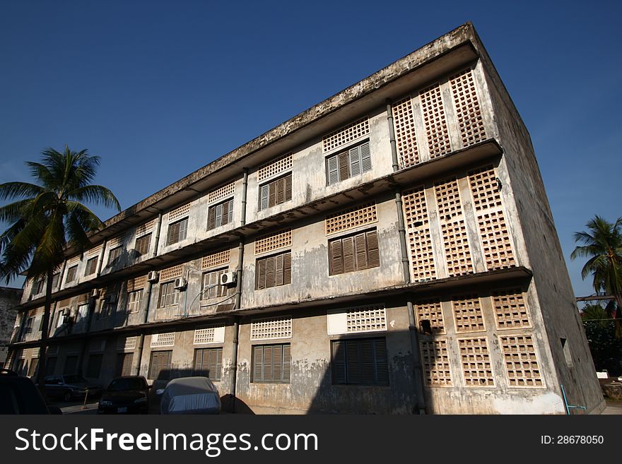 S21 Tuol Sleng Genocide Museum with barb wires covering the building