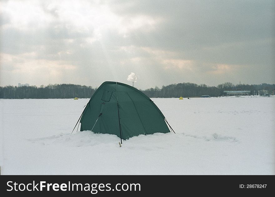 Fisherman`s tent on an iced lake. Fisherman`s tent on an iced lake