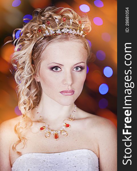 Portrait of a beautiful young bride in a white dress