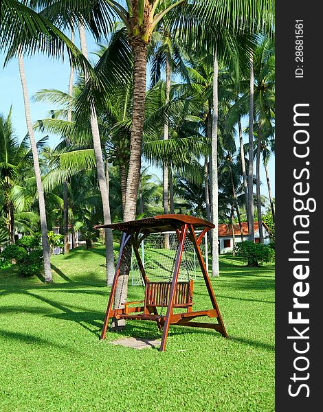 Swings at a beautiful park on a luxury tropical resort. Swings at a beautiful park on a luxury tropical resort