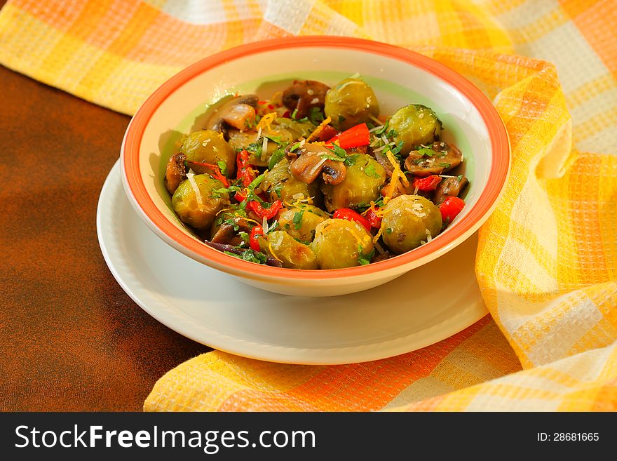 Vegetarian dish with brussels sprouts, mushrooms and red peppers