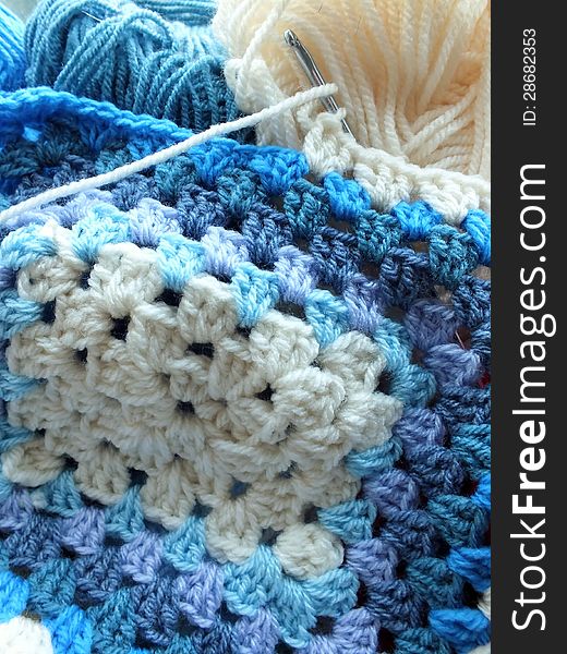 Hand crocheted afghan blue and cream crochet blanket. Hand crocheted afghan blue and cream crochet blanket