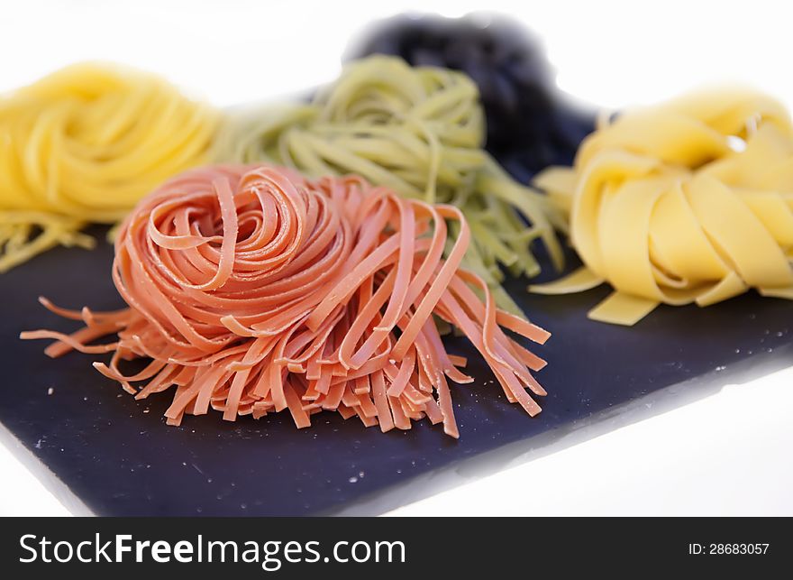 Raw assortment of four color pasta