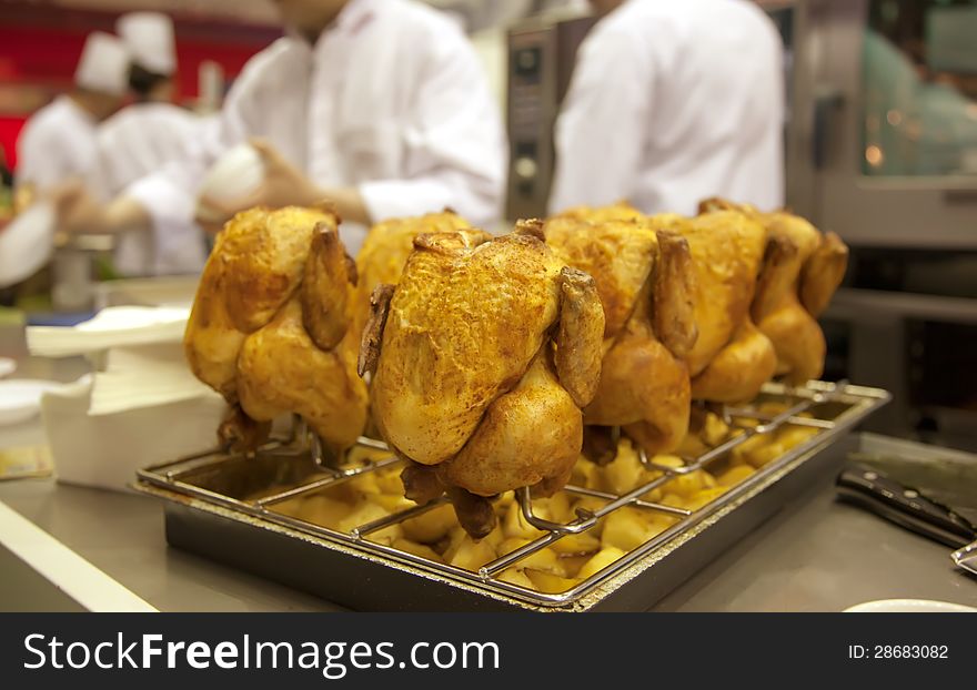 Grilled chicken on restaurant kitchen