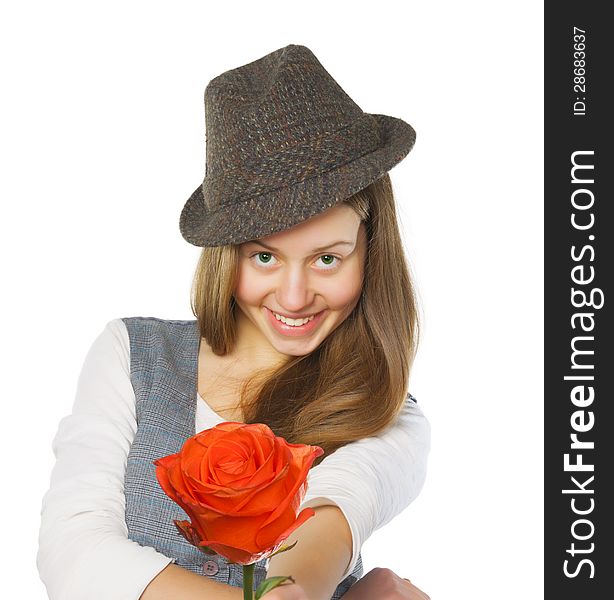 Smiling teen girl in hat giving a rose. Isolated on white. Smiling teen girl in hat giving a rose. Isolated on white