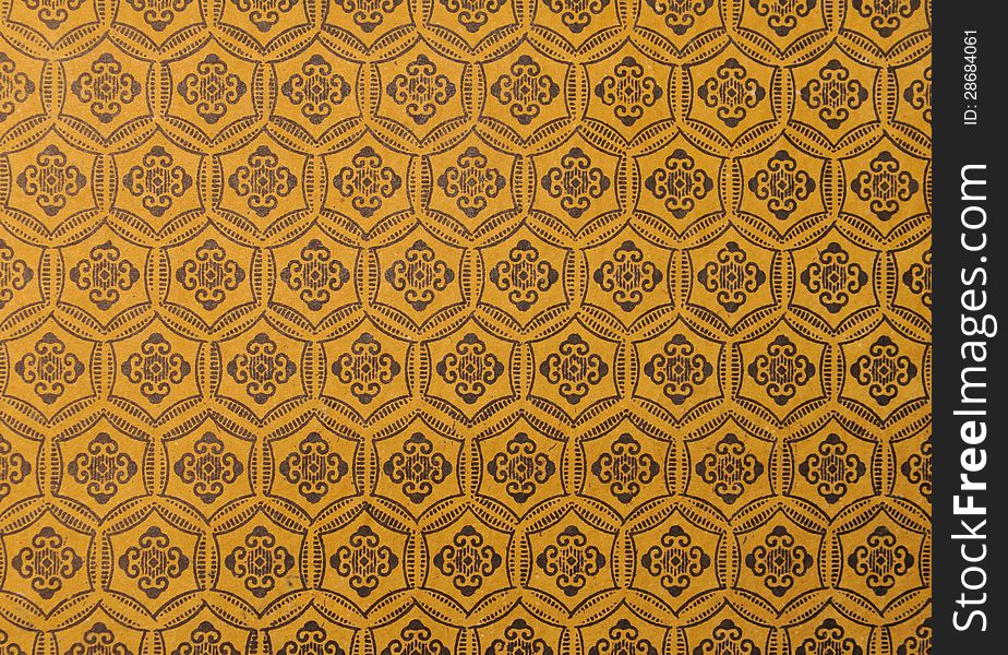 Background with pattern of curlicues on yellow background. Background with pattern of curlicues on yellow background
