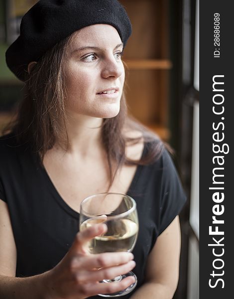 Portrait of a young woman with white wine. Portrait of a young woman with white wine.