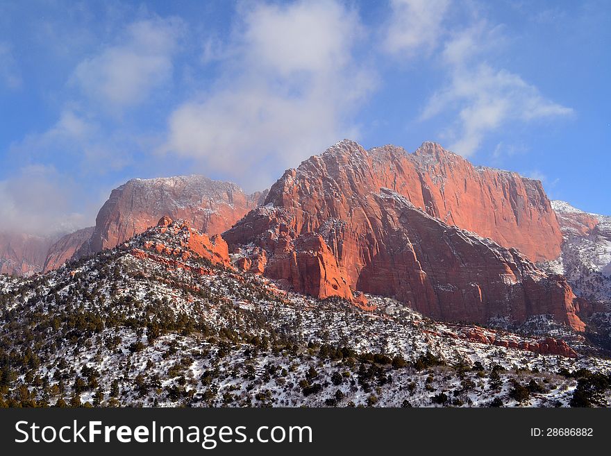 A winter scene of snow and red rocks in Utah. A winter scene of snow and red rocks in Utah.