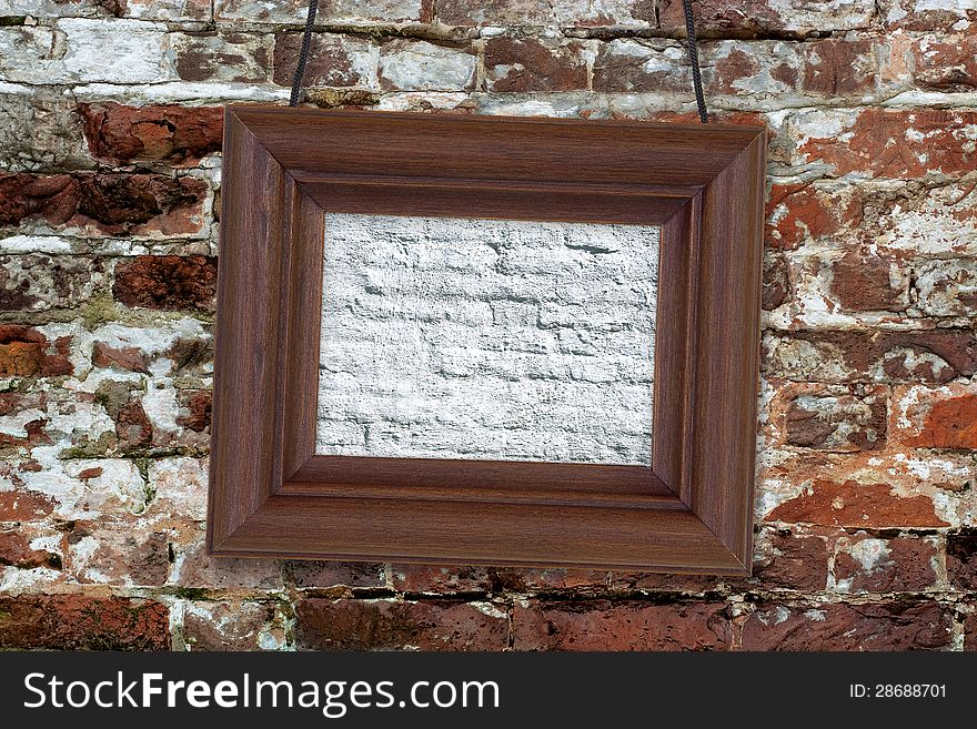 Painting in wooden frame hanging on an old brick wall. Painting in wooden frame hanging on an old brick wall