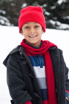 Happy East Indian Boy Playing In The Snow Royalty Free Stock Photography Happy East Indian Boy Playing In The Snow Royalty Free Stock Photography