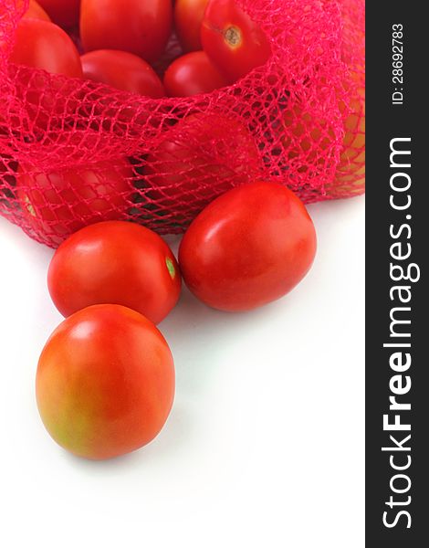 Fresh juicy organic tomatoes on white background. The fruits are ripe and bright red in color and ready for consumption