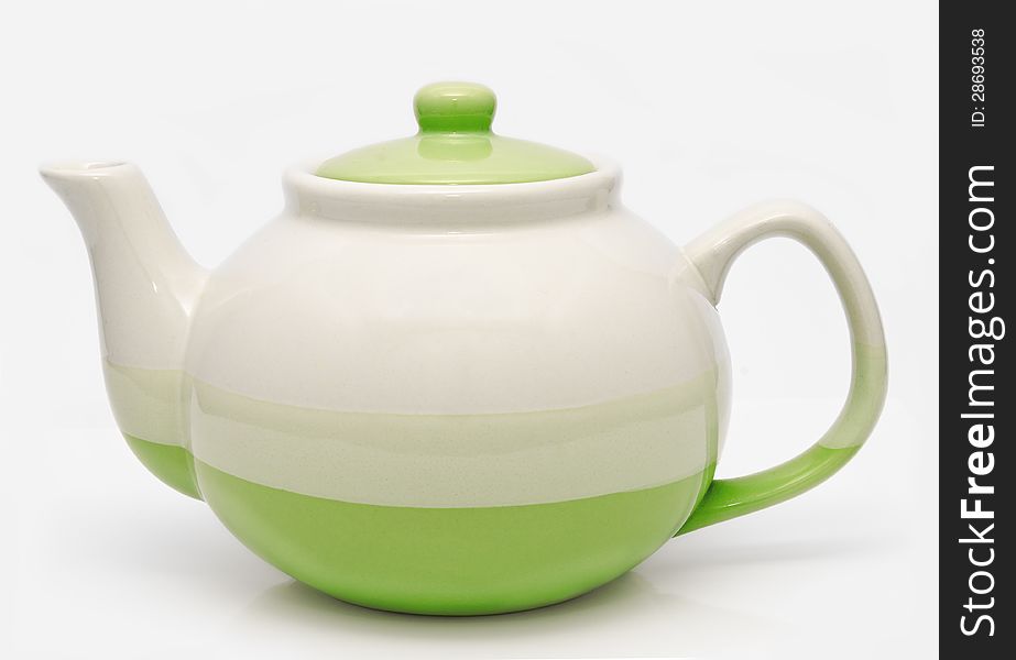 Green teapot  on a white