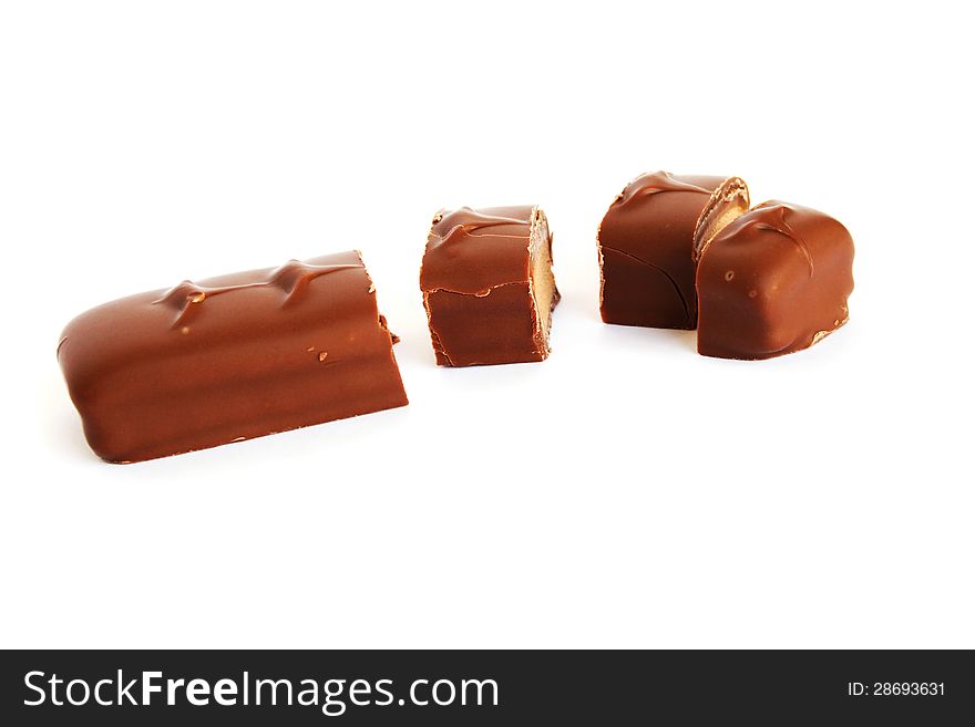 Chocolate on white background, horizontal picture.