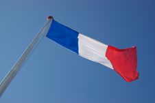 French Flag In Blue Sky Stock Image French Flag In Blue Sky Stock Image