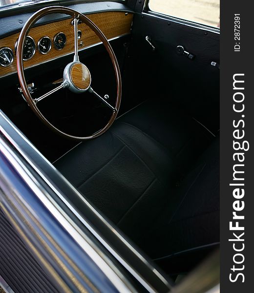 View of the interior of an old vintage car. View of the interior of an old vintage car