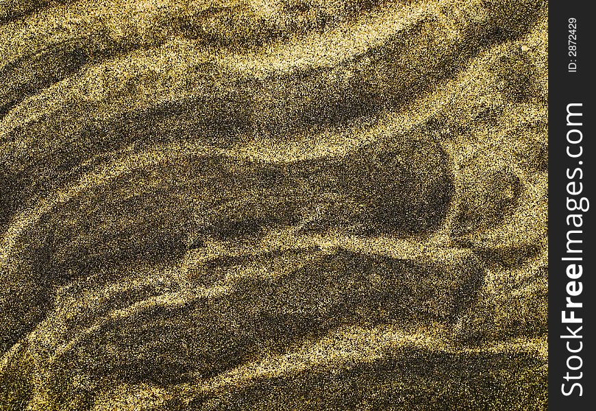 Texture of a sand surface with wave pattern. Texture of a sand surface with wave pattern