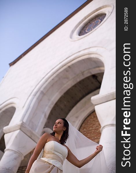 Bride in front of the church. Bride in front of the church