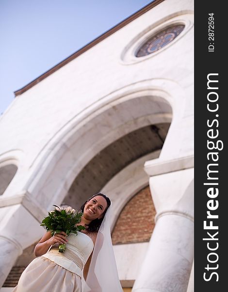 Bride in front of the church. Bride in front of the church