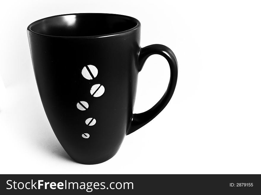 Black coffee cup isolated on white with coffee grains
