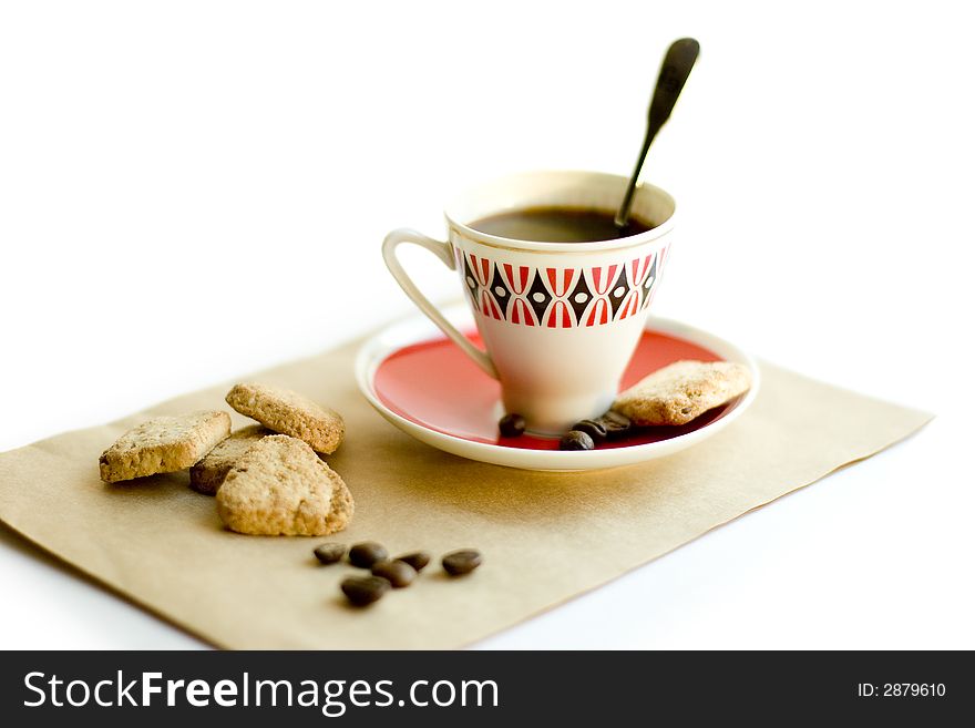Black coffee, spoon, cookies on white background. Black coffee, spoon, cookies on white background