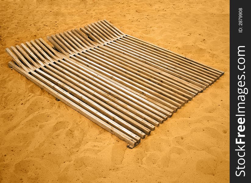 Chaise longue on sand of beach