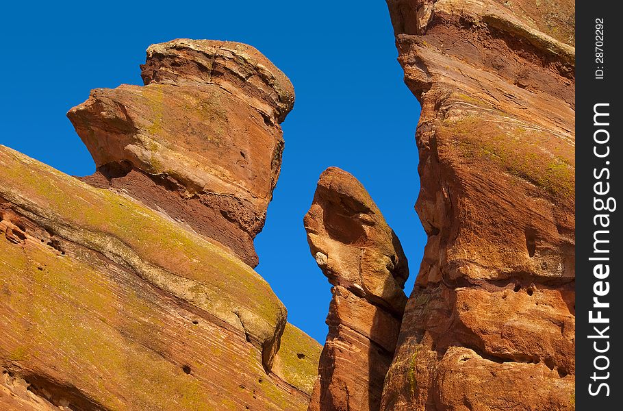 Insteresting red rock formation comes alive against a deep blue sky. Insteresting red rock formation comes alive against a deep blue sky.